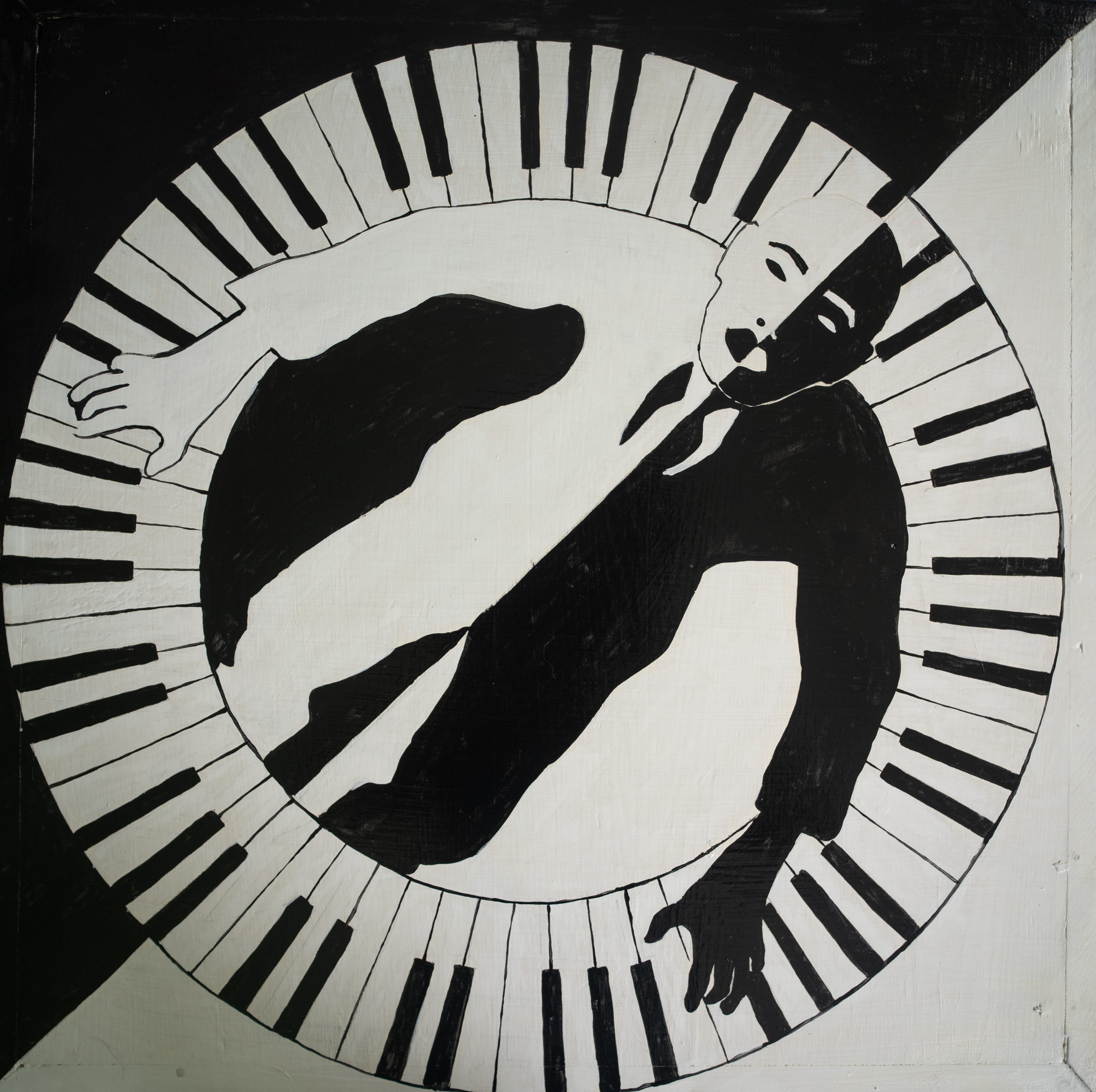 Black-and-white figurative composition encircled by piano keys